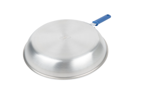 Fry pan with blue handle face down.