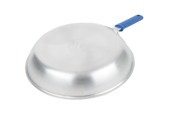 Non stick fry pan with blue handle face down.