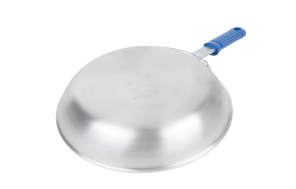 Fry pan with blue handle face down.