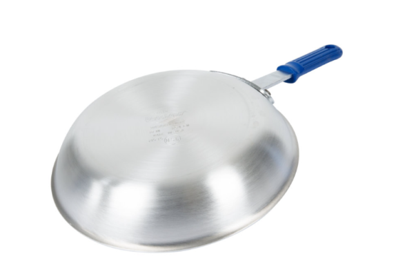 Fry pan with blue handle face down.