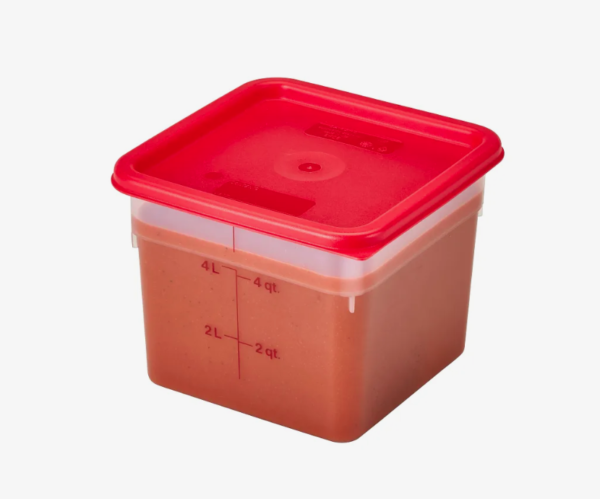 Food storage container with tomato soup and red lid