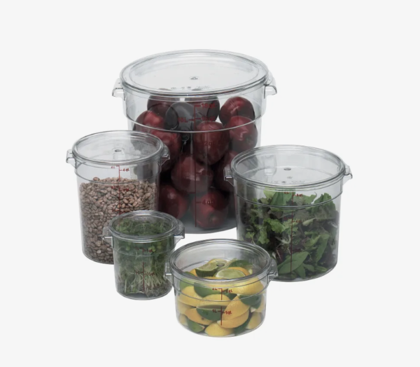 Round food storage containers containing lettuce, onions, lemons/ limes, and nuts.