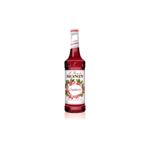 Glass bottle with red liquid with cranberries on the label