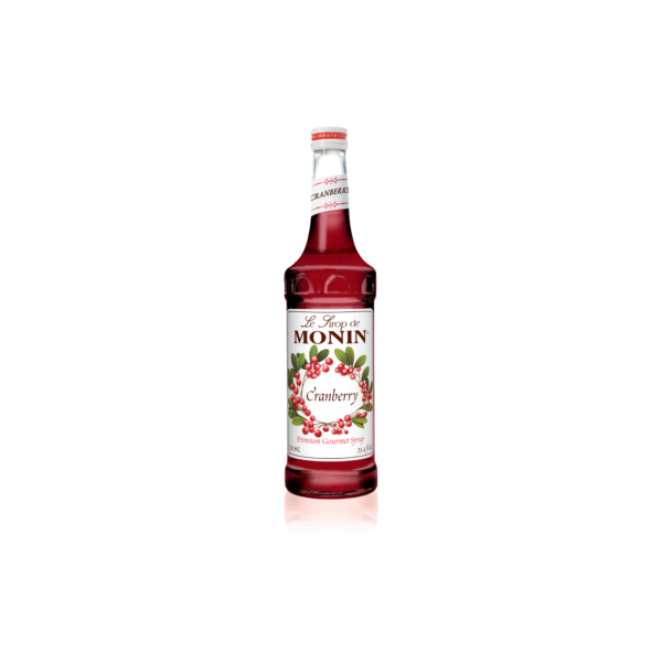 Glass bottle with red liquid with cranberries on the label