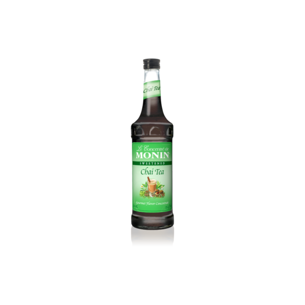 Glass bottle with brown liquid with chai tea on the label