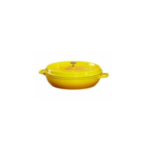 Yellow round braiser with black interior.